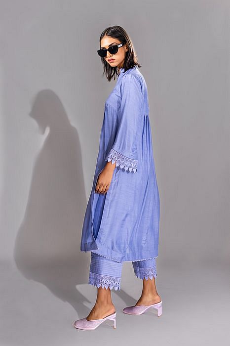 A model showcasing Lavender Color Cotton Suit With French Borders by Shruti S Label from Shruti S Label's collection