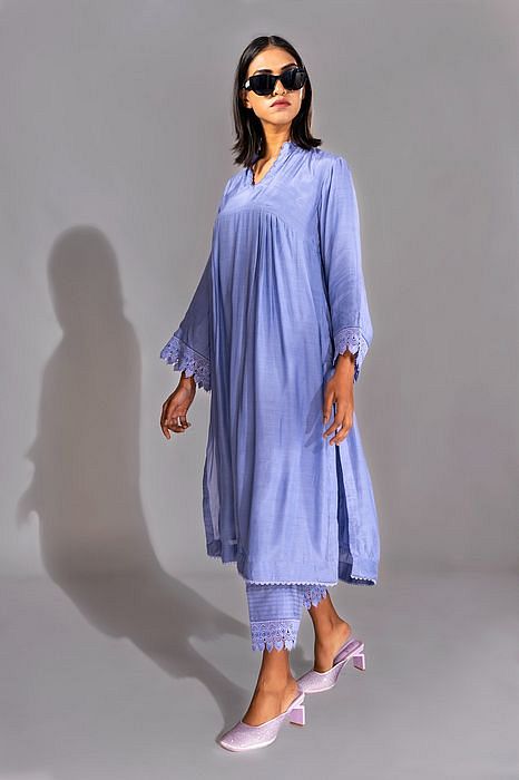A model showcasing Lavender Color Cotton Suit With French Borders by Shruti S Label from Shruti S Label's collection