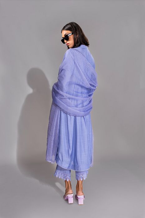 A model showcasing Lavender Color Cotton Suit With French Borders by Shruti S Label from Shruti S Label's collection