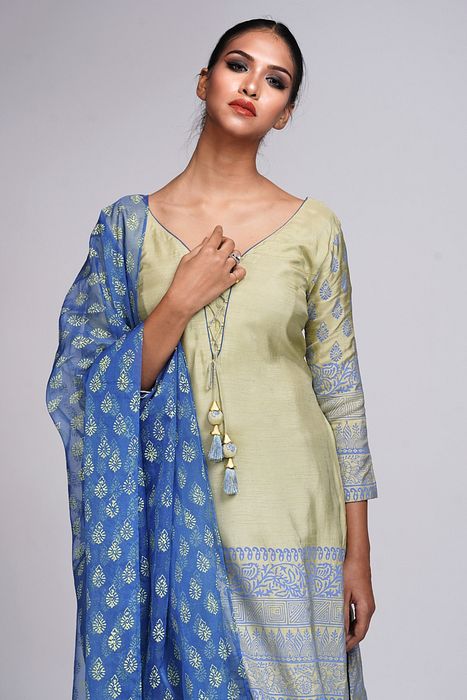 A model showcasing Hand Painted Churidaar Suit by Shruti S Label from Shruti S Label's collection