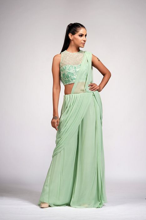A model showcasing Sage Green Bell Bottom Saree With Embroidery by Shruti S Label from Shruti S Label's collection