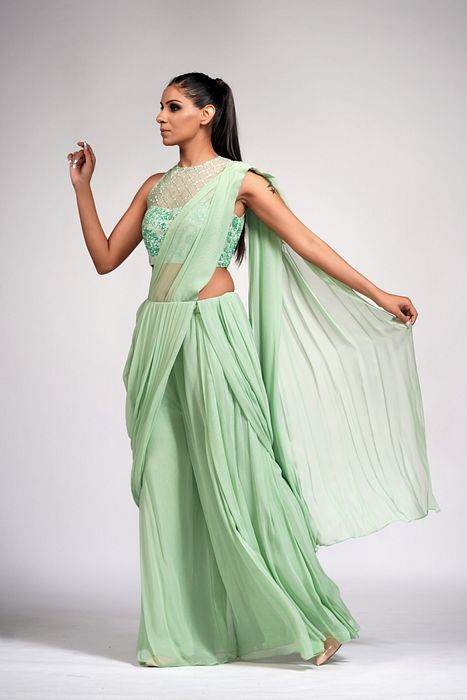 A model showcasing Sage Green Bell Bottom Saree With Embroidery by Shruti S Label from Shruti S Label's collection