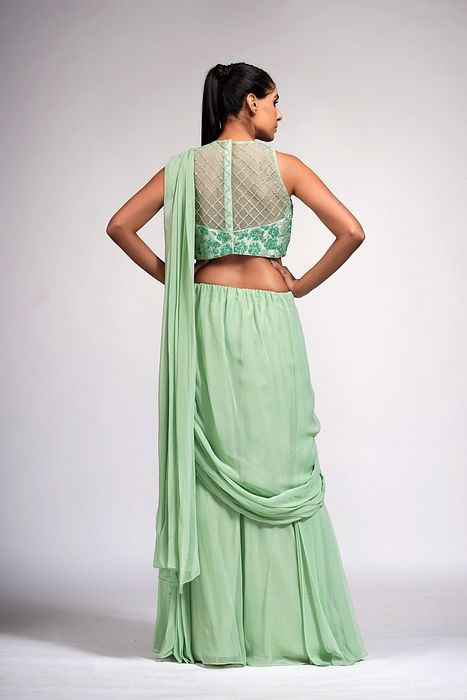 A model showcasing Sage Green Bell Bottom Saree With Embroidery by Shruti S Label from Shruti S Label's collection