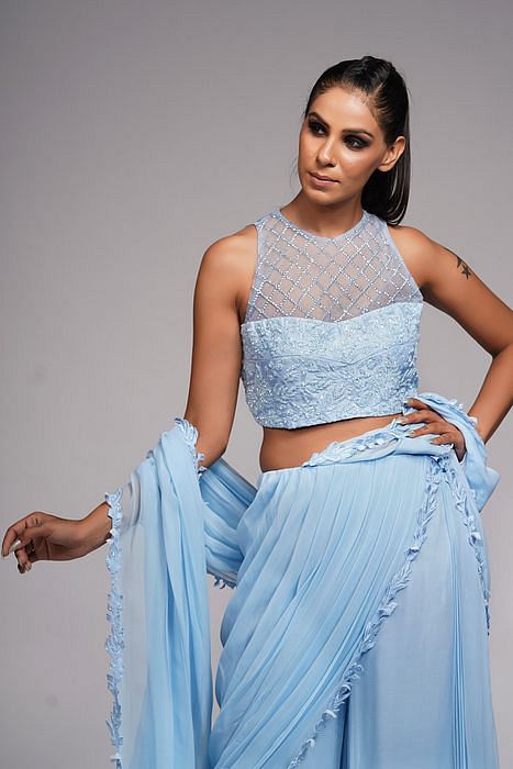 A model showcasing Ice Blue Bell Bottom Saree With Embroidery by Shruti S Label from Shruti S Label's collection