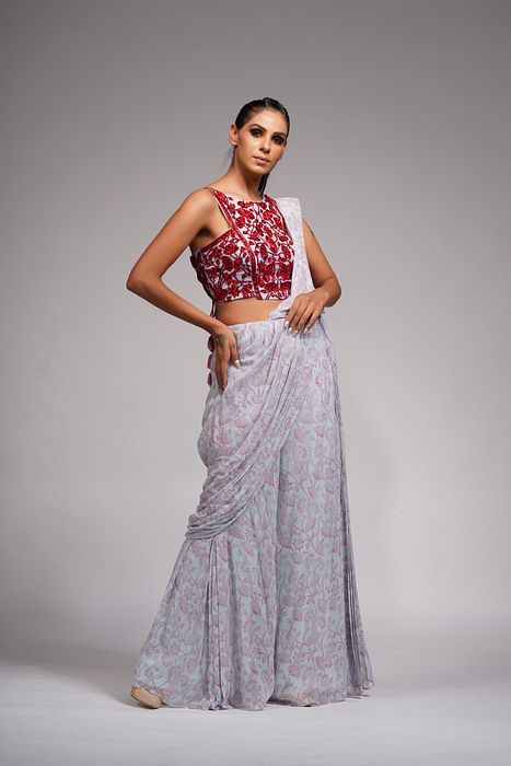 A model showcasing Red Embroidery Hand Painted Bell Bottom Saree by Shruti S Label from Shruti S Label's collection