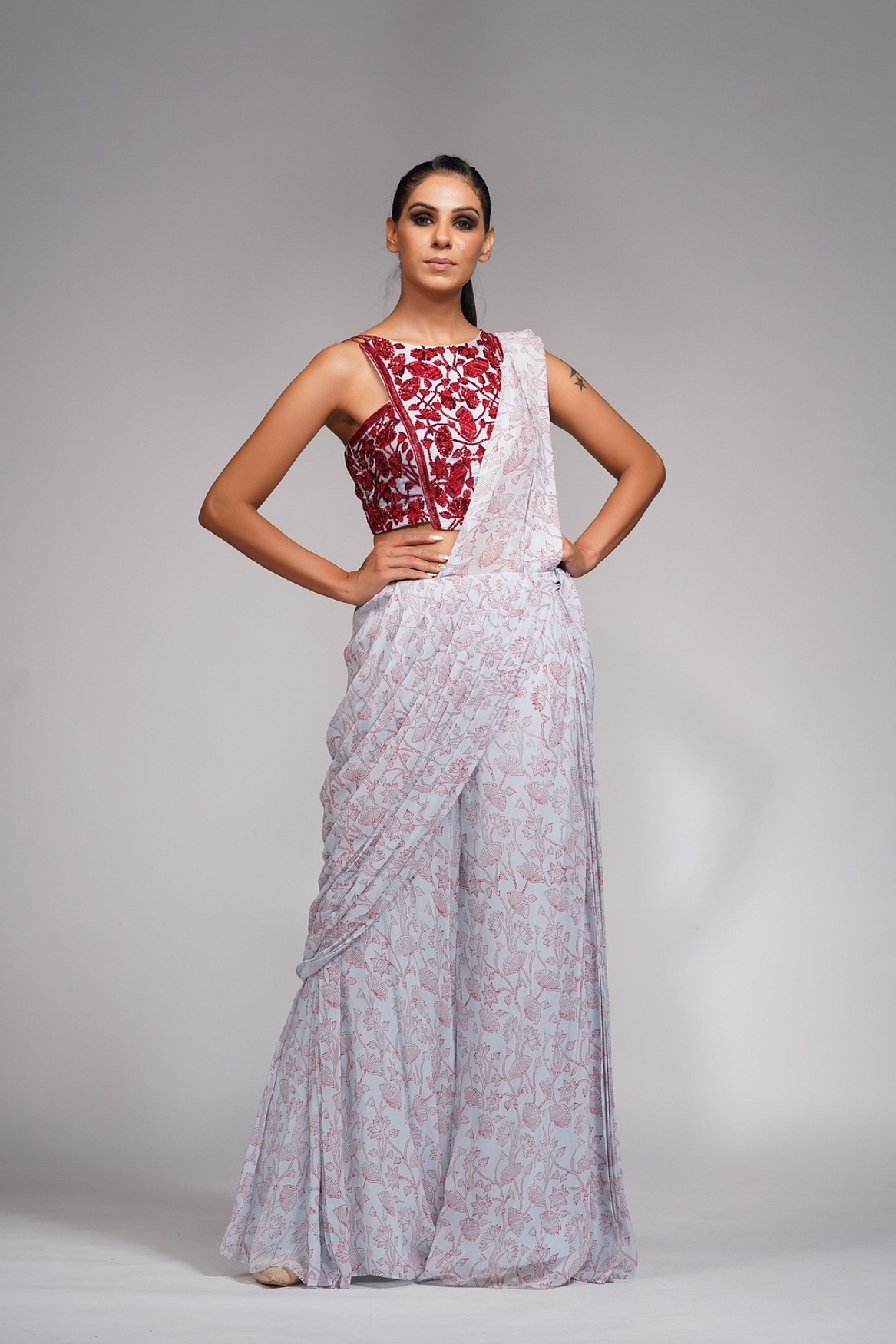 A model showcasing Red Embroidery Hand Painted Bell Bottom Saree Feature image by Shruti S Label from Shruti S Label's collection