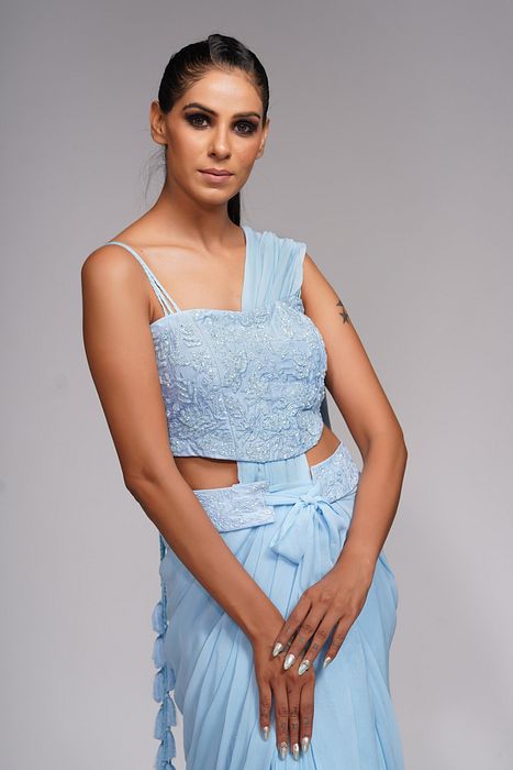 A model showcasing Ice Blue Ruffle Saree With Belt by Shruti S Label from Shruti S Label's collection