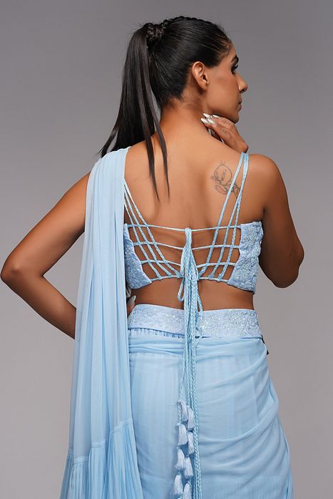 A model showcasing Ice Blue Ruffle Saree With Belt by Shruti S Label from Shruti S Label's collection