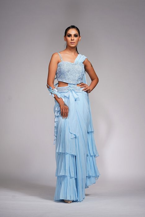 A model showcasing Ice Blue Ruffle Saree With Belt by Shruti S Label from Shruti S Label's collection