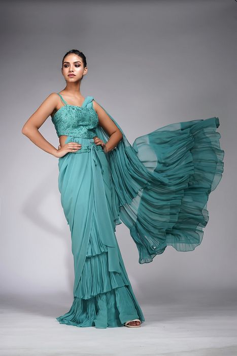 A model showcasing Embroidered Ruffle Saree Green by Shruti S Label from Shruti S Label's collection