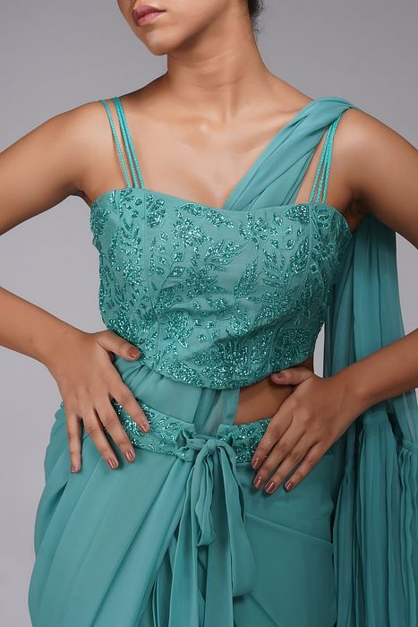 A model showcasing Embroidered Ruffle Saree Green by Shruti S Label from Shruti S Label's collection