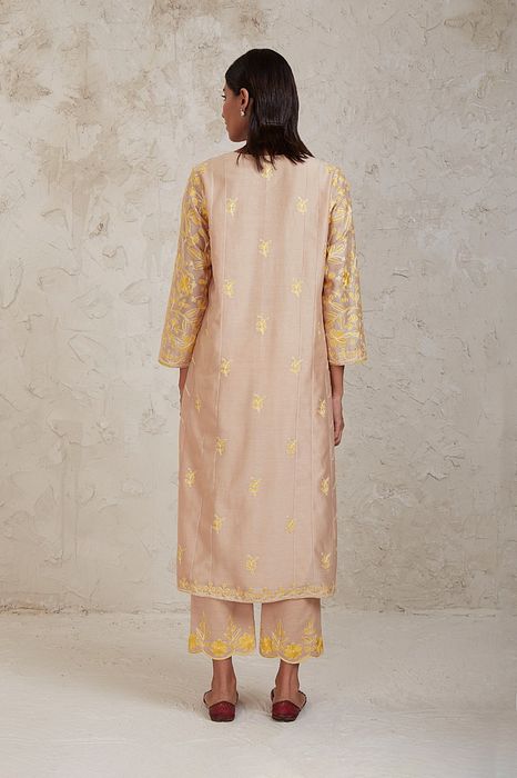 A model showcasing Hanan Beige Kurta Set by Sue Mue from Sue Mue's collection