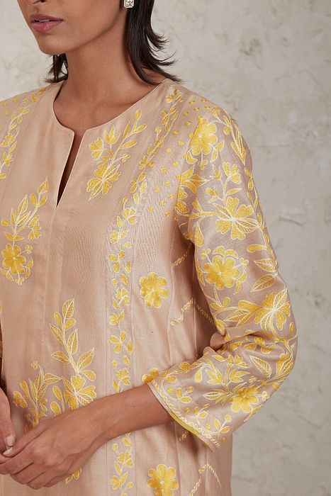 A model showcasing Hanan Beige Kurta Set by Sue Mue from Sue Mue's collection