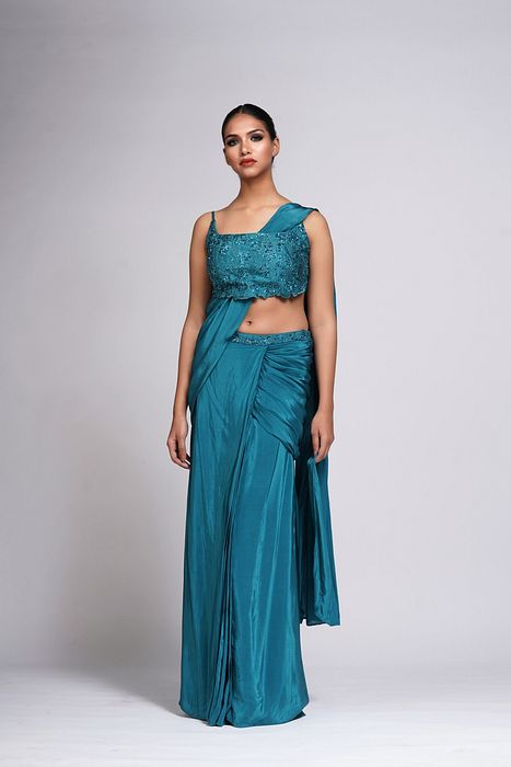 A model showcasing Grapevine Teal Green Pre Stitched Saree by Shruti S Label from Shruti S Label's collection