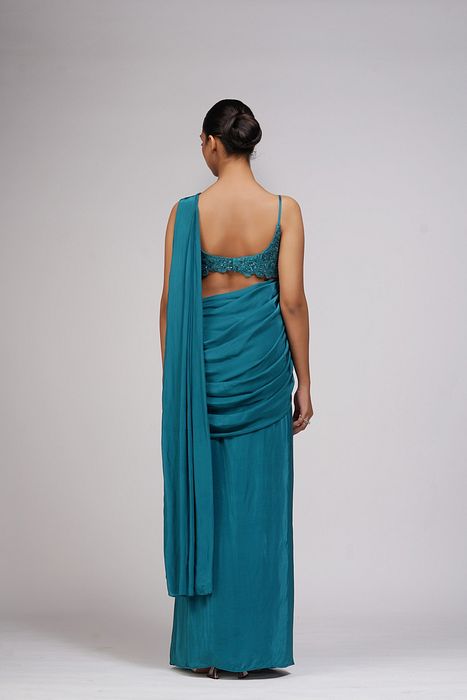 A model showcasing Grapevine Teal Green Pre Stitched Saree by Shruti S Label from Shruti S Label's collection