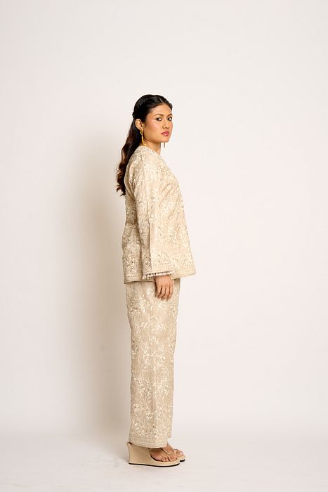 A model showcasing Antique Beige Gulnaaz Twin Set by Ashtar from Ashtar's collection